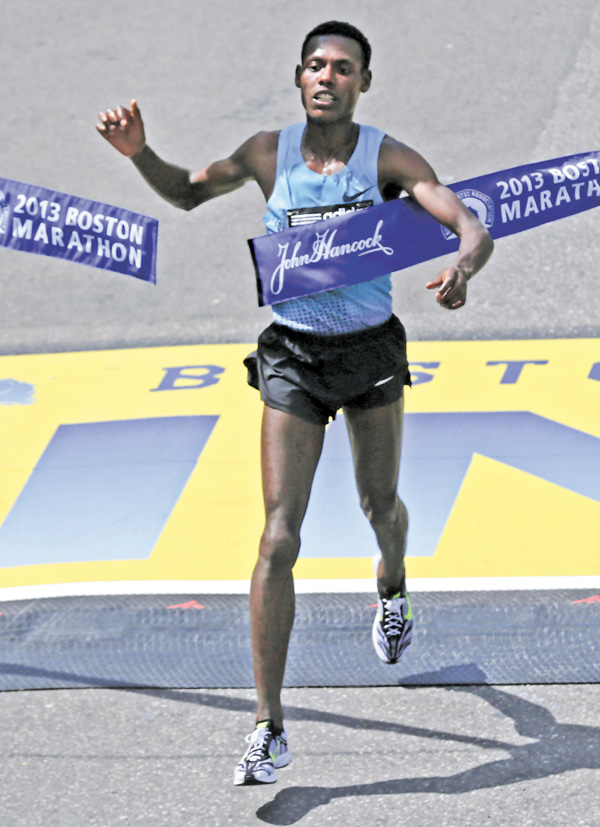 Lelisa Desisa of Ethiopia breaks the finish line tape to win the 2013 running of the Boston Marathon in Boston on
Monday.