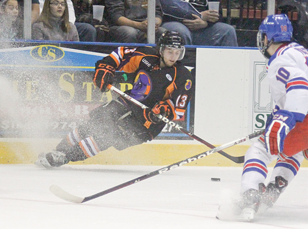 Phantoms defenseman Ryan Lowney moves to keep the puck away from Des Moines’ Luke Voltin during a game at the Covelli Centre. Lowney is one of the Phantoms’ penalty killers. Their unit is ranked first in the USHL.