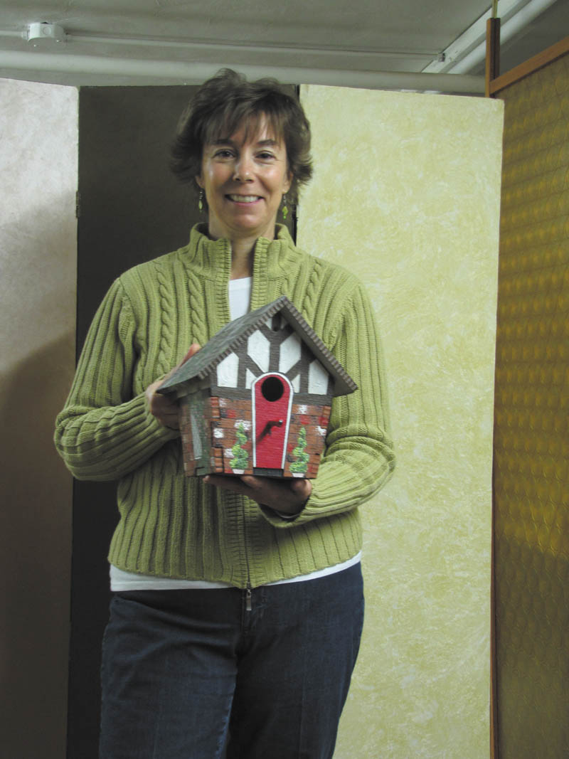 SPECIAL TO THE VINDICATOR
Shari Fry is holding a Tudor birdhouse she created for the birdhouse decorating contest sponsored by Springtime in Columbiana set for May 3 and 4 on Main Street.