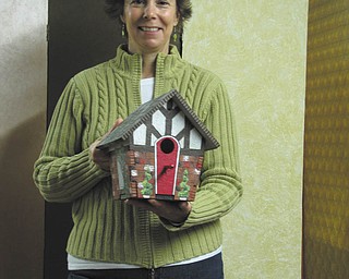 SPECIAL TO THE VINDICATOR
Shari Fry is holding a Tudor birdhouse she created for the birdhouse decorating contest sponsored by Springtime in Columbiana set for May 3 and 4 on Main Street.