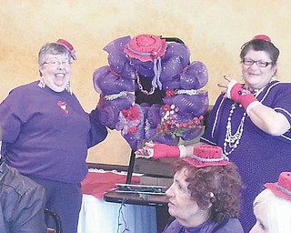 SPECIAL TO THE VINDICATOR
Peppy Purple Red Hats recently celebrated its 10th anniversary at Soni’s Restaurant, New Castle, Pa. Matching hats were made especially for the occasion, and the mascot was named Piper. The red team won games and received red pipe cleaner ring prizes from the door prize wreath. The purple losers team received mardi gras bead necklaces for their efforts. April events were discussed. Seated from left are Pat Loupzenhiser, Mardi Meyers and Joanne McGhee (head partially showing); and standing are Jean Josa and Therese Jumper.