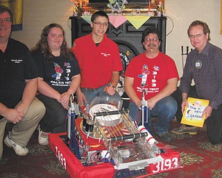 SPECIAL TO THE VINDICATOR
Members and advisers of Austintown Fitch Robotics Team visited Rotary Club of Austintown during a recent meeting. Eileen Yantes and Wesley Pringle demonstrated the 2013 robot, a Frisbee-tossing machine. It won awards at various competitions. The group had 27 participants this year. They have six weeks to build their entry. Worldwide there are 2,143 teams and the Austintown team shares and cooperates with teams from Warren, Girard and Canfield. The school provides a work space but the teams must raise funds to build the units. From left are Jim Yantes, adviser; Eileen and Wesley, students; Ric Zimmerman, adviser; and Ron Carroll, Rotary president.