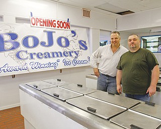 John Evan and Bob McAllister stand inside their newest BoJo’s Creamery store on Market Street in Boardman. The business partners plan to open the shop late this month.
