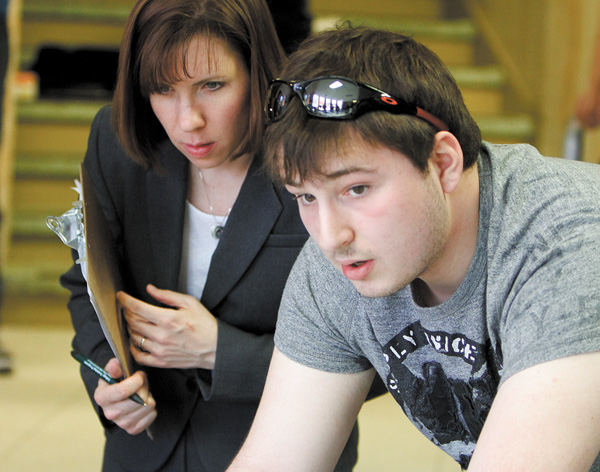 Donny Dixon, a first-year engineering student at Youngstown State University, and Kerry Meyers, director of the First-Year Engineering Program, demonstrate a prototype he designed and built for the Oh Wow! Roger & Gloria Jones Children’s Center for Science and Technology downtown.