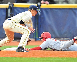 Youngstown State’s Phil Lipari slides into third base, beating the tag of Kent State’s Justin Wagler during the second game of a doubleheader Tuesday.