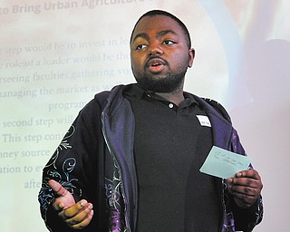Denzel Stevens presents his senior project on Urban Agriculture in Warren for Inspiring Minds, a program
for Warren high school students that focuses on motivating young people to succeed while avoiding bad
influences from the street. Former college and pro football player Deryck Toles leads the program.