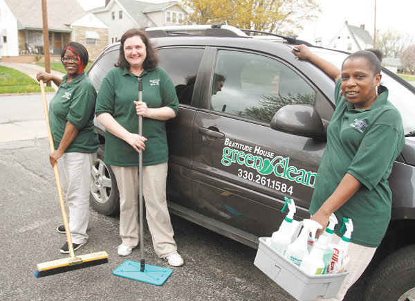 Three owners of Beatitude House Green Clean, a co-op company, stand next to one of the vehicles used by the business. They are, from left, Remona Gordon, Joyce Koellner and Rose Mary Seals.