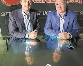 Ultimate Gaming chairman Tom Breitling, left, and CEO Tobin Prior sit for a photo at their company headquarters in Las Vegas on Monday. The social-gaming company launched the first legal, real-money poker site in the U.S. on Tuesday.