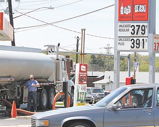 A fuel truck delivers gas to a station on Mahoning Avenue in Austintown. Drivers have seen gas prices go up
in the Valley, but this is normal for the spring season, according to experts.