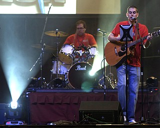 Kelli Cardinal/The Vindicator
Brandon Matteson (right) of Greenford Christian Church, performs Saturday with one of the church's praise and worship groups during the Men's Rally in the Valley at the Covelli Center in Youngstown. The group performed a number of songs including one called "More than Amazing."