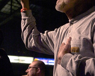 Kelli Cardinal/The Vindicator
Dave Harris, of Mineral Ridge, sings along Saturday to "Our God" with performers from Greenford Christian Church during the Men's Rally in the Valley at the Covelli Center in Youngstown. Harris said he came to the rally this year to "worship with his brothers."