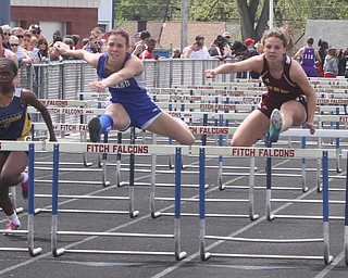 NICK MAYS l THE VINDICATOR Sage Spotleson of Poland and Ashley Pryce of Stow race to the finish in the 100 meter hurdles Saturday afternoon in Austintown. 05042013 austintown, ohio