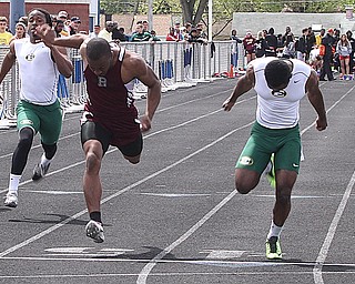 NICK MAYS l THE VINDICATOR Nathan Jones of Boardman and Shaun Crawford of St. Edwards reach for the finish in the 100 meter dash Saturday afternoon in Austintown. 05042013 austintown, ohio