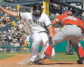 Nationals catcher Wilson Ramos (40) cannot handle the relay throw and the Pirates’ Gaby Sanchez scores on
a double by Russell Martin during the sixth inning Sunday’s baseball game in Pittsburgh. Washington rallied in
the eighth to down the Pirates, 6-2.