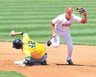 YSU short stop Phil Lipari steps on second to force Wright State’s Michael Timm out before turning a double
play to first during the eighth inning of Sunday’s game at Eastwood Field in Niles. The Penguins hung on to
win 7-4.