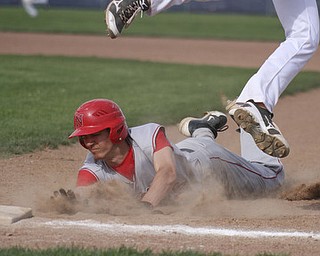 William d Lewis the vindicator Niles Cameron Carson15) gets back to first ahead of the throw as Fitch Firstbaseman Phil Socha(14) tries for the catch.