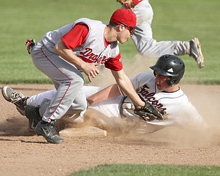 William d Lewis the vindicator Fitch's Phil Socha (14) steals 2nd as Niles Jacob Foster(3) tries to mamke the tag during 5-6-13 game at Fitch.