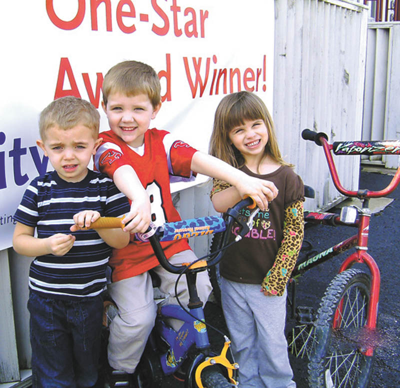 SPECIAL TO THE VINDICATOR
Austintown Community Church Preschool will sponsor a bike-a-thon May 13 through 16 at the church, 242 S. Canfield-Niles Road. Cindy Ellashek, preschool director, says the children develop motor skills while learning about bicycle safety. Ready to conquer the course are Evan Grenamyer, left, Jason Corll and Victoria Jones. Classmates will design and construct buildings from cardboard boxes to create a town for the bike course. Ohio Department of Jobs and Family Services recently recognized the preschool for going beyond Ohio’s licensing standards. There also will be a bake sale May 14 and 15 during the event, which will support a relay scheduled for June 7 and 8 at the high school.