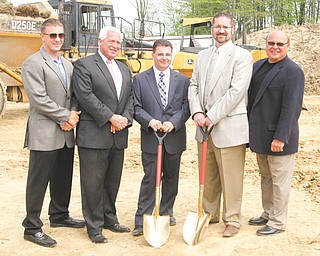 From left, Jim Pastore, Carl Frakovitch, Tim Huber, Joe Cilone, and Larry Petrozzi share in the groundbreaking
for an $8 million senior-care center in Hubbard on Tuesday morning. Phase one of the project consists of
the facility’s assisted-living home, which will cover 36,000 square feet.