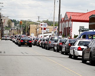 MADELYN P. HASTINGS | THE VINDICATOR
Traffic aligned Shenango streets as hundreds of police officers leave the funeral service of Shenango Township Police Officer William “Jerry” McCarthy who was killed by Kylee Barletto in a car chase on May 2, 2013.