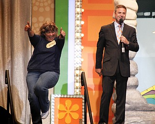 MADELYN P. HASTINGS | THE VINDICATOR
A contestant, Patricia from Youngstown, shows her excitement for the game with host Mark Walberg during the 'Price Is Right Live' show at the Covelli Centre on May 8, 2013.