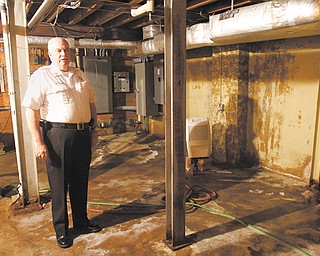 Boardman Township Fire Chief George Brown stands in the basement of the main fire station on U.S. Route
224 near Southern Boulevard. The basement is riddled with mildew, sump pumps and dehumidifiers. The
township is trying to devise a plan to renovate the station or build a new one. Lack of money is the main obstacle.
