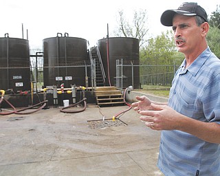 David Ballentine, president of Northeast Ohio Oilfield Service Inc., stands at the storage facility of his injection-well site in Windham, where fracking wastewater is first accepted before being piped to the actual injection well a few hundred yards away.