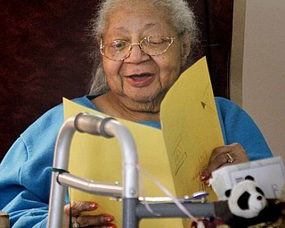 MADELYN P. HASTINGS | THE VINDICATOR
Danridge Nursing Home resident, Olive Dixon, smiles as she reads a Mother's Day card given to her by students involved in the after school program at Martin Luther King Elementary.
