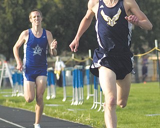Patrick Kunkel, a senior from McDonald High School, leads the second heat of the boys 1,600-meter run during the Trumbull County Track and Field Meet on Thursday at Lakeview High School in Cortland. Kunkel took first place and also was named running MVP. Team honors went to Lakeview boys and McDonald girls.