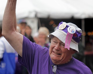 MADELYN P. HASTINGS | THE VINDICATOR
Cancer survivor, Ron Laskey of Warren, celebrates after completing the first lap of the Relay for Life in Warren. The Warren Relay for Life, the largest in the state in terms of money raised, was held on Courthouse Square in downtown Warren on May 10, 2013.