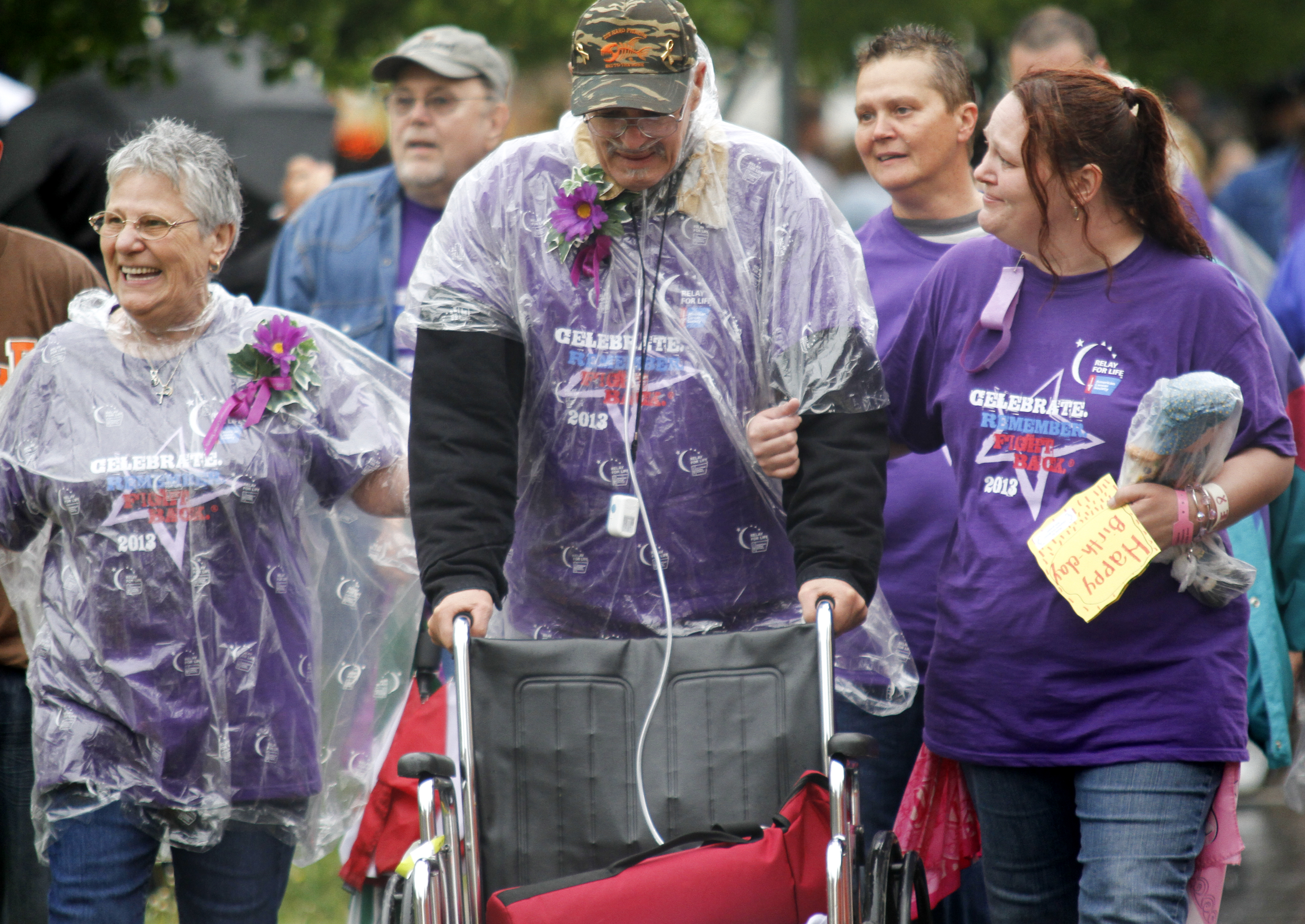 MADELYN P. HASTINGS | THE VINDICATOR

(L-R) Gloria and Edward Sersich walk with their daughter Esther Pelayo, all from Warren in the Relay for Life. Edward is suffering from stage 4 bladder and lymphoma cancer and completed the entire first lap of the relay without the use of his wheelchair. The Warren Relay for Life, the largest in the state in terms of money raised, was held on Courthouse Square in downtown Warren on May 10, 2013.