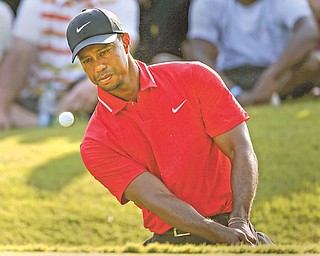 Tiger Woods hits onto the 15th green during the final round of The Players championship golf tournament
Sunday at TPC Sawgrass in Ponte Vedra Beach, Fla.