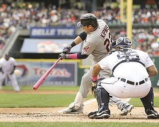 Cleveland Indians’ Jason Kipnis (22) hits a two-run double off Detroit Tigers starting pitcher Rick Porcello during the third inning of a game in Detroit on Sunday.