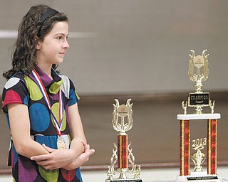 Jackie Grisdale listens to a presentation about her wins as grand champion of the 2013 National Handwriting Competition. The fourth-grader was honored by language-arts company Zaner-Bloser as the grade-level state, national and grand national champion of its annual contest.