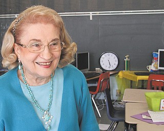 Rae Jeanne Mollica visits her old classroom at Watson Elementary in Austintown during a Monday open house at the school. She started teaching there in 1963 and is now a tutor at the school, which is set to close as new buildings are constructed.