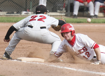 William D Lewis The Vindicator  Niles' Jacob Foster(12) gets back to first ahead of the ball during a 2nd inning pickoff attempt Tuesday in Niles. Canfield 1rst baseman Alec Hammond(22) waits for the throw. Niles won 1-0.