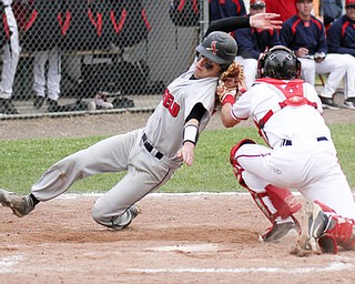 William D Lewis The Vindicator Canfield's Tom Ciccolelli(11) is out at the plate as Niles catcher Ryan Ifft(4) makes the tag during Tuesday game at Niles. Dragons won 1-0.