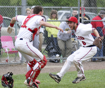 William d Lewis the Vindicator  Niles catcher Ryan Ifft(4) and pitch Tyler Wiery(6) celebrate after defeating Canfield 1-0 during a Tuesday game at Niles.