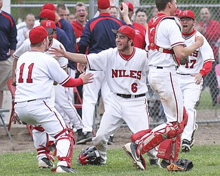 William d Lewis The Vindicator Niles catcher Tyler Wiery(6) celebrates with team mates Cameron Carson(11) Ryan Ifft(4) and Brennan Baker(17) after defeating Cnfield 1-0 during 5-14 game at Niles.