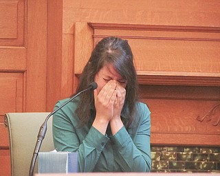 Alexis Hugel of Girard cries on the witness stand Tuesday while testifying about the events of April 6, 2012, the day her best friend, Christine Sheesley, overdosed on heroin.