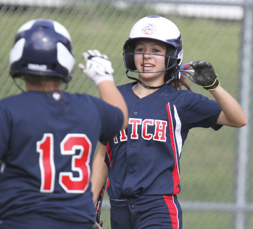 William D. Lewis\The Vindicator Fitch's Cali Mikovich(3) gets congrats from Alex Corradi(13) after scoring during 2nd inning of game with Kent. Fitch won 4-2..