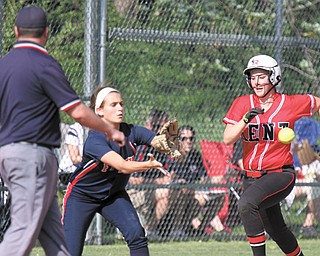 Kent’s Mary Gavriloff (15) heads to first base, but is out as Fitch first baseman Gabby Butcher(11) makes the
catch during their Division I tournament softball game Wednesday at Fitch High School in Austintown. Trailing 1-2 until the sixth inning, Butcher, a junior, connected for a two-out RBI double to put the Falcons ahead, 3-2. A single by Mercedes Pratt scored Butcher and gave Fitch the 4-2 win. The Falcons’ next game is set for Tuesday
at The Fields of Dreams in Boardman.