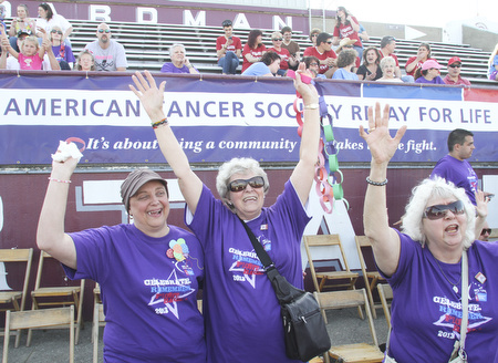 William D. Lewis The Vindicator Cheering during Boardman Relay For Life Friday May17,2013 are cancer survivors from left, Pam Hart of Girard, Kathyrn Senedak of North Jackson and Anita Hart of Girard.