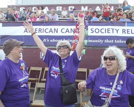 William D. Lewis The Vindicator Cheering during Boardman Relay For Life Friday May17,2013 are cancer survivors from left, Pam Hart of Girard, Kathyrn Senedak of North Jackson and Anita Hart of Girard.