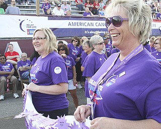 William d Lewis The Vindicator Cancer survivors Melissa Cherne, left, and Carol McGraw, both of Boardman, lead the survivors lap of hte Boardm Relay for Life Friday. McGraw, a 17 year survivor, was a speaker at the event.