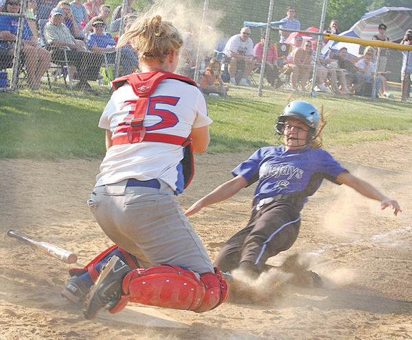 Western Reserve catcher Marley Oles blocks the plate as Jackson-Milton’s Zaina Sahli tries to score during a Division IV softball semifinal Monday in Lisbon. The Bluejays ousted the Blue Devils, 8-5, and advance to the 
final against Mineral Ridge.