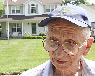 William D. Lewis\The Vindicator
Meter Fromel, 85, has placed flags along his street in Austintown.