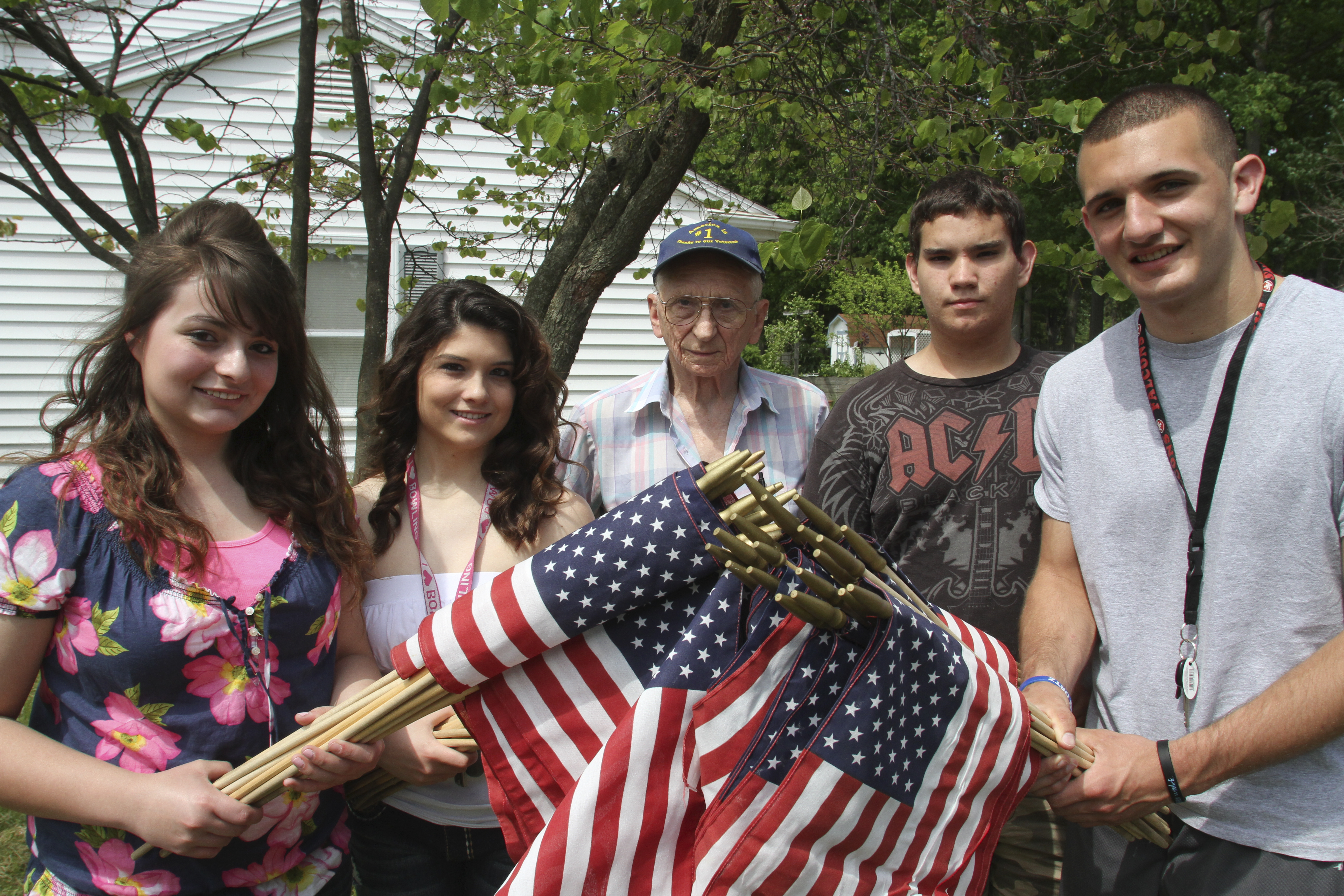 William D. Lewis\The Vindicator
Posing with flags to be placed on Austintown streets are from left: Lynnette Seebacher, Laura Wilson, Meter Fromel, Ricky Ferry and Camran Rezapourian. Fromel is an 85 year old MArine vet who enlisted the help of studnetsw in Austintown Fitch NHS students.