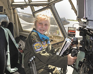 Kylee Vidas of Howland sits in the cockpit of one of the 910th Airlift Wing’s C-130 Hercules military transport aircraft at the Youngstown Air Reserve Station in Vienna. Kylee, who has Type I diabetes, was sworn in Wednesday as an honorary Air Force Reserve second lieutenant and made Pilot for a Day at the 910th.