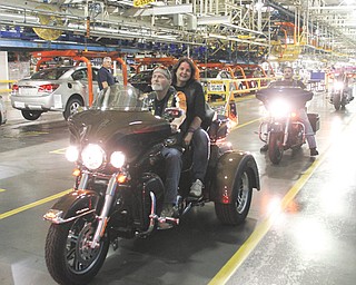 Randy Cramer, an employee at the General Motors Assembly Plant in Lordstown, and his wife, Vicky, were among those who rode their motorcycles into the facility as part of a March of Dimes fund drive.